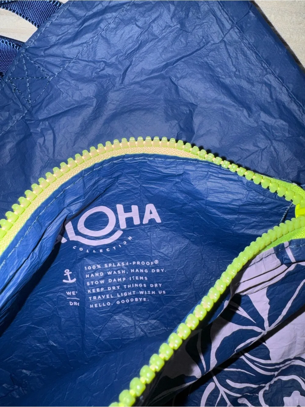 ALOHA Collection reversible navy tote with lime logo and matching pouch